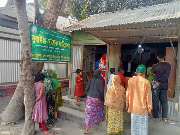 Volunteers of Suraiya-Khalek Foundation distributing winter clothes and blankets to underprivileged people during a winter support campaign.